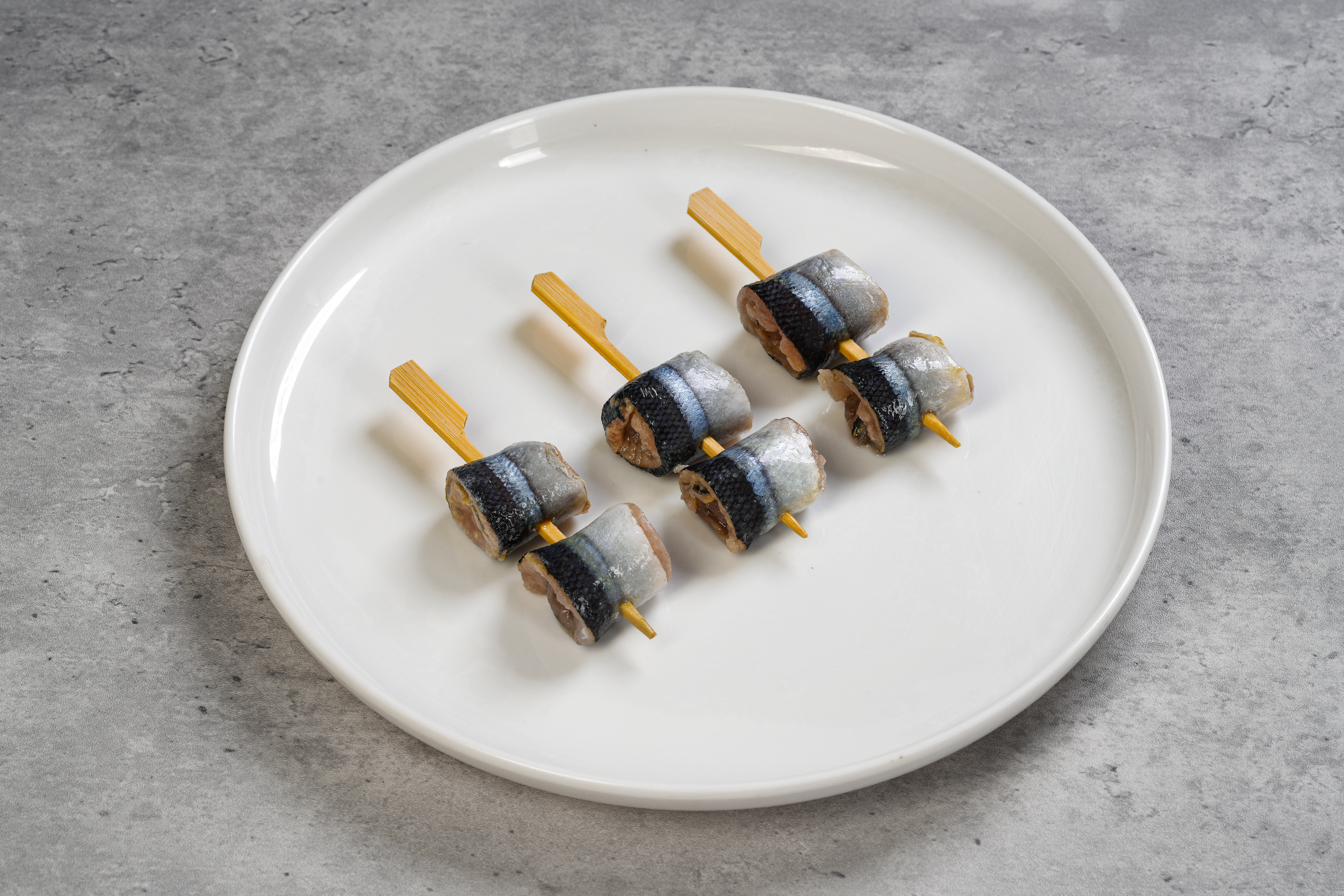 Saury Roll Skewer — rolled Pacific saury pieces on bamboo skewer, IQF